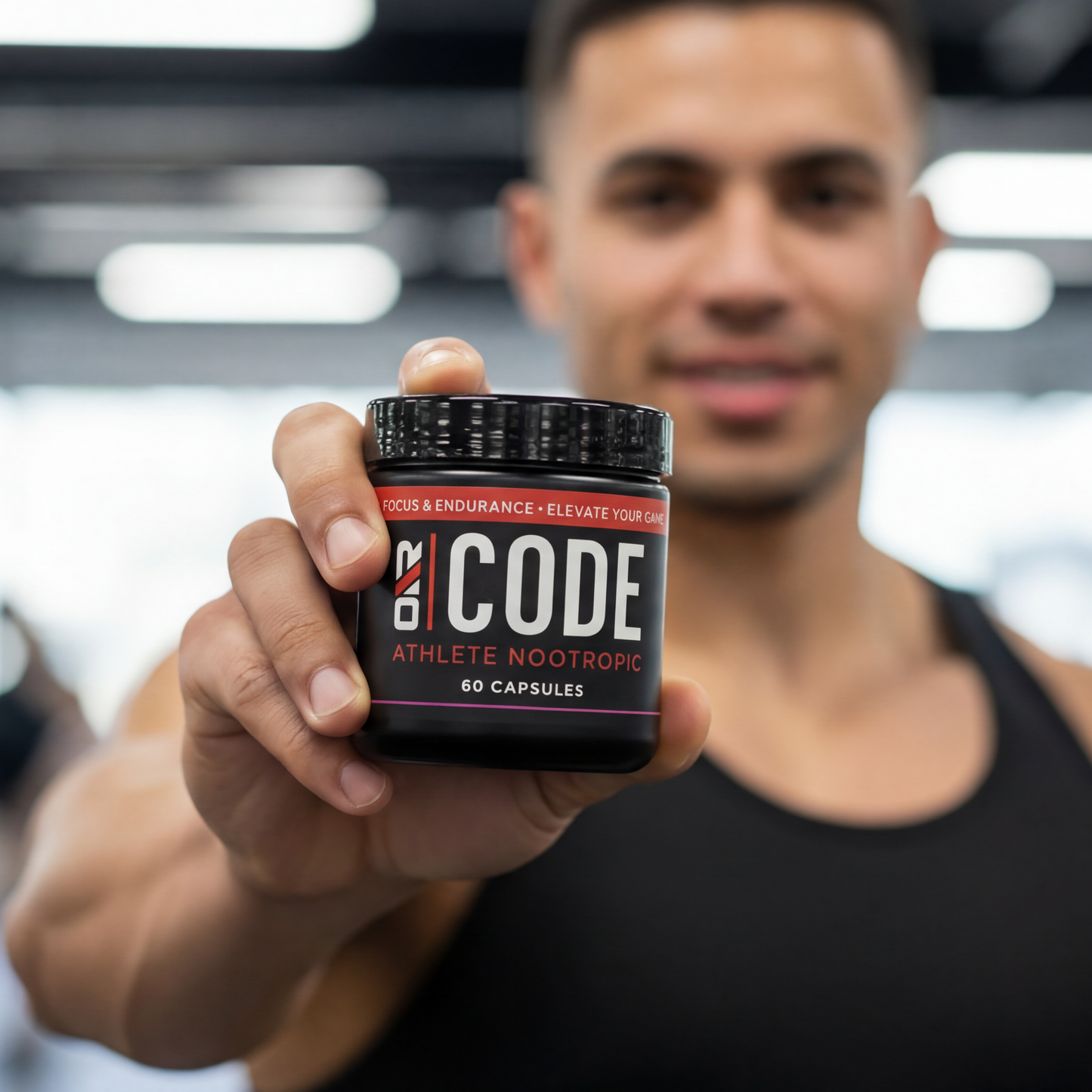 Man holding a container labeled 'CODE' in a gym setting